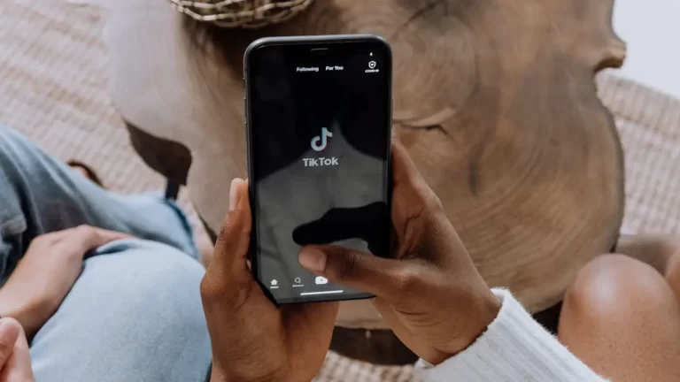 TikTok App opened on a phone held by a person